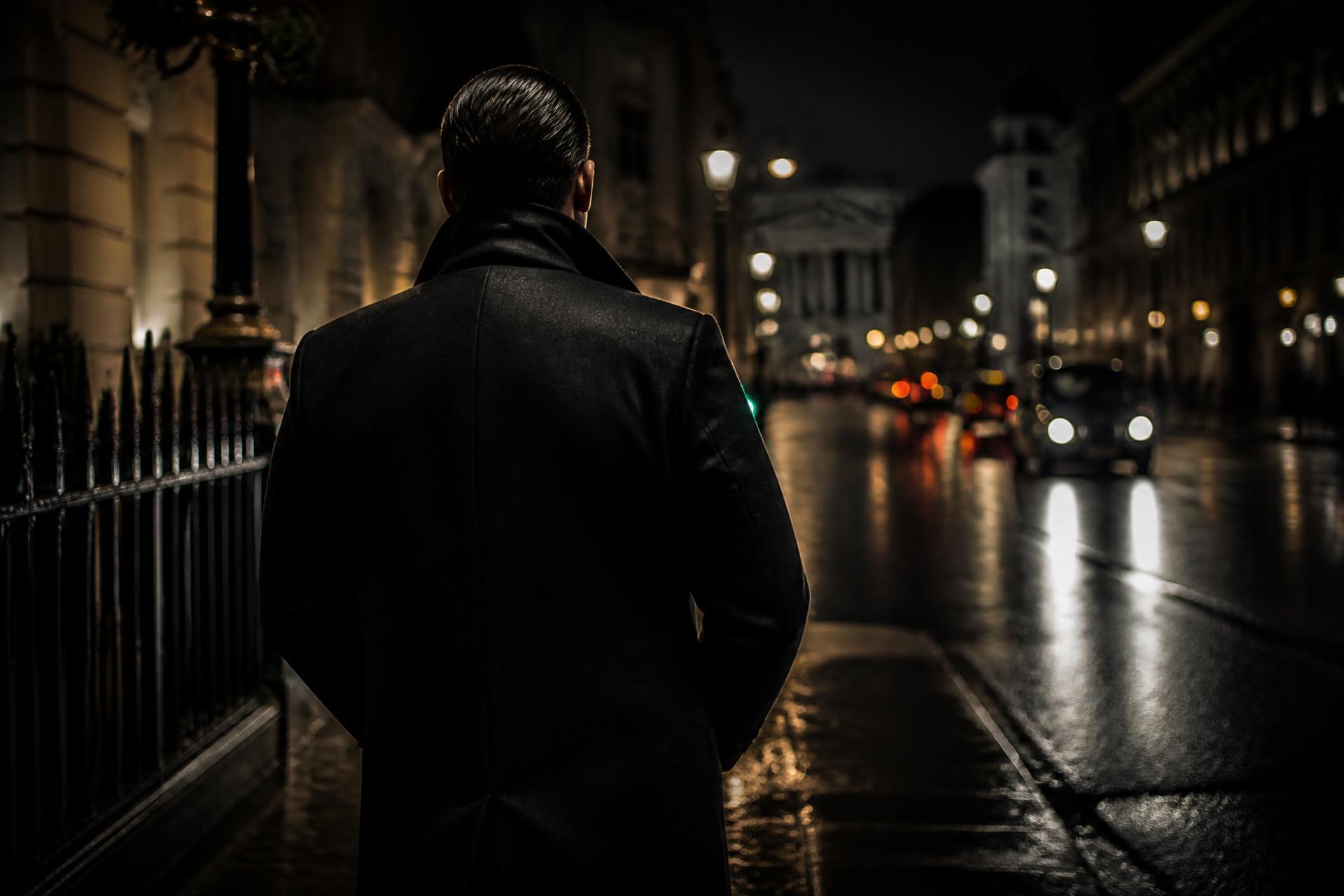 Protection officer observing a London street at night